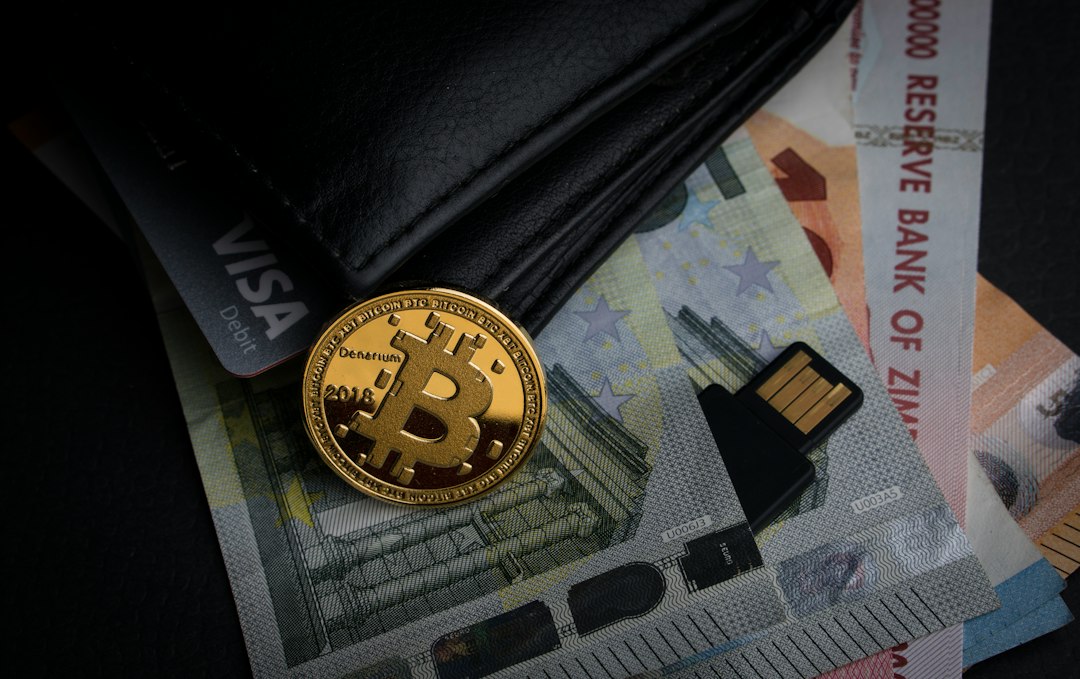a bitcoin sitting on top of a pile of money