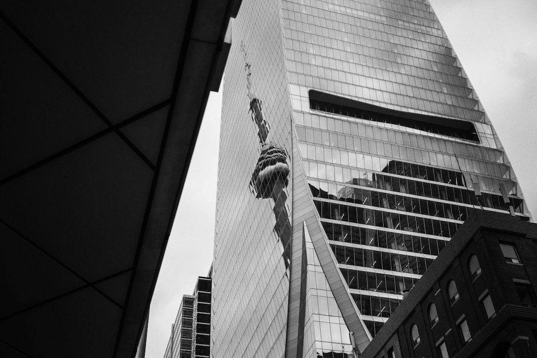 A skyscraper shows damage along its facade.