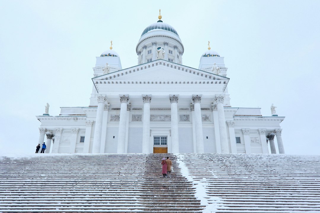 a large white building with steps leading up to it