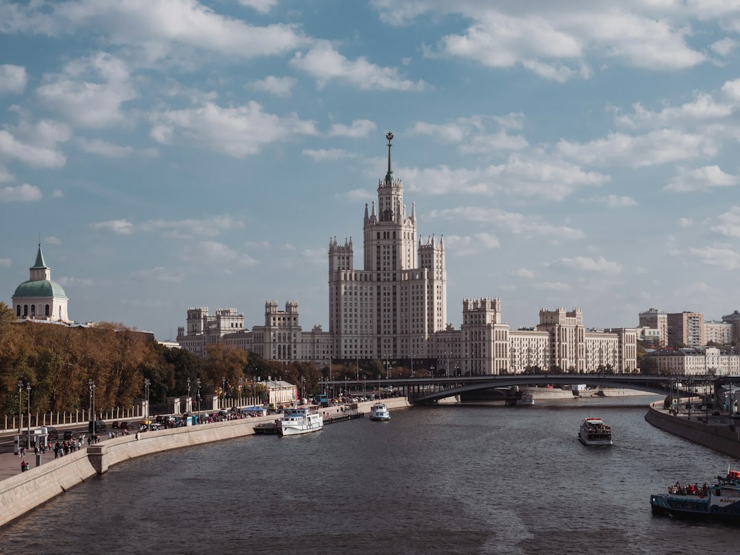 a view of a river with a bridge and a city in the background