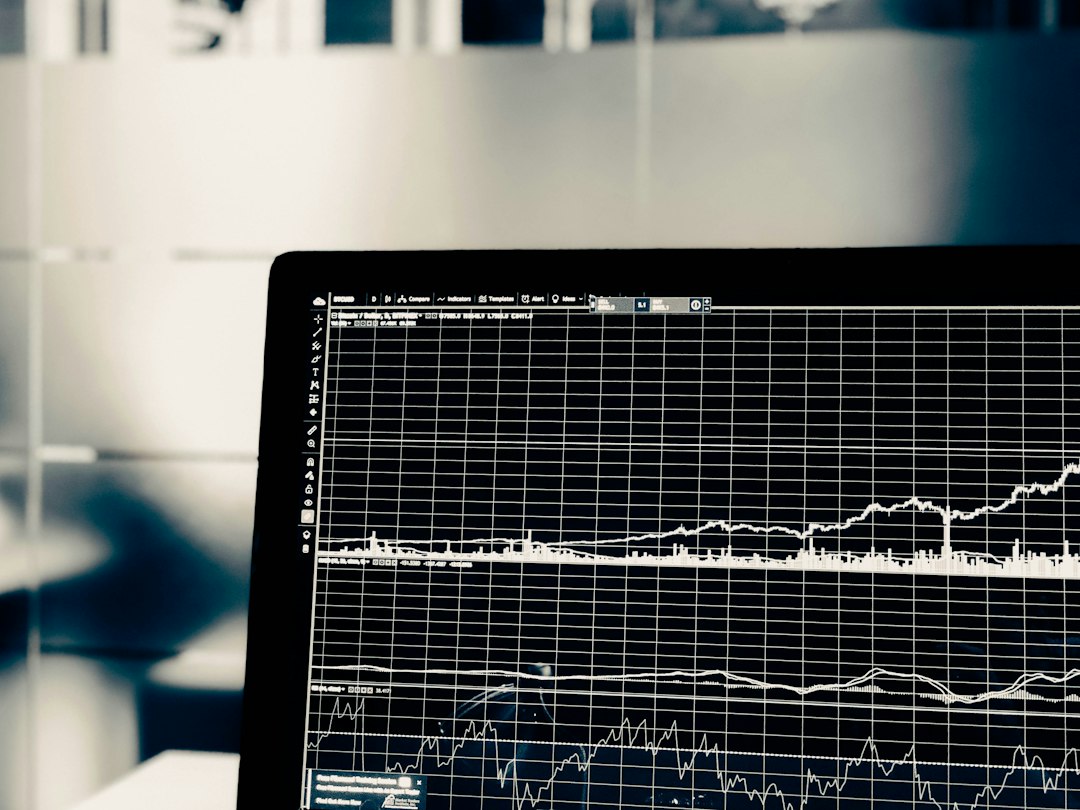 A computer screen displaying a white line graph of financial market data