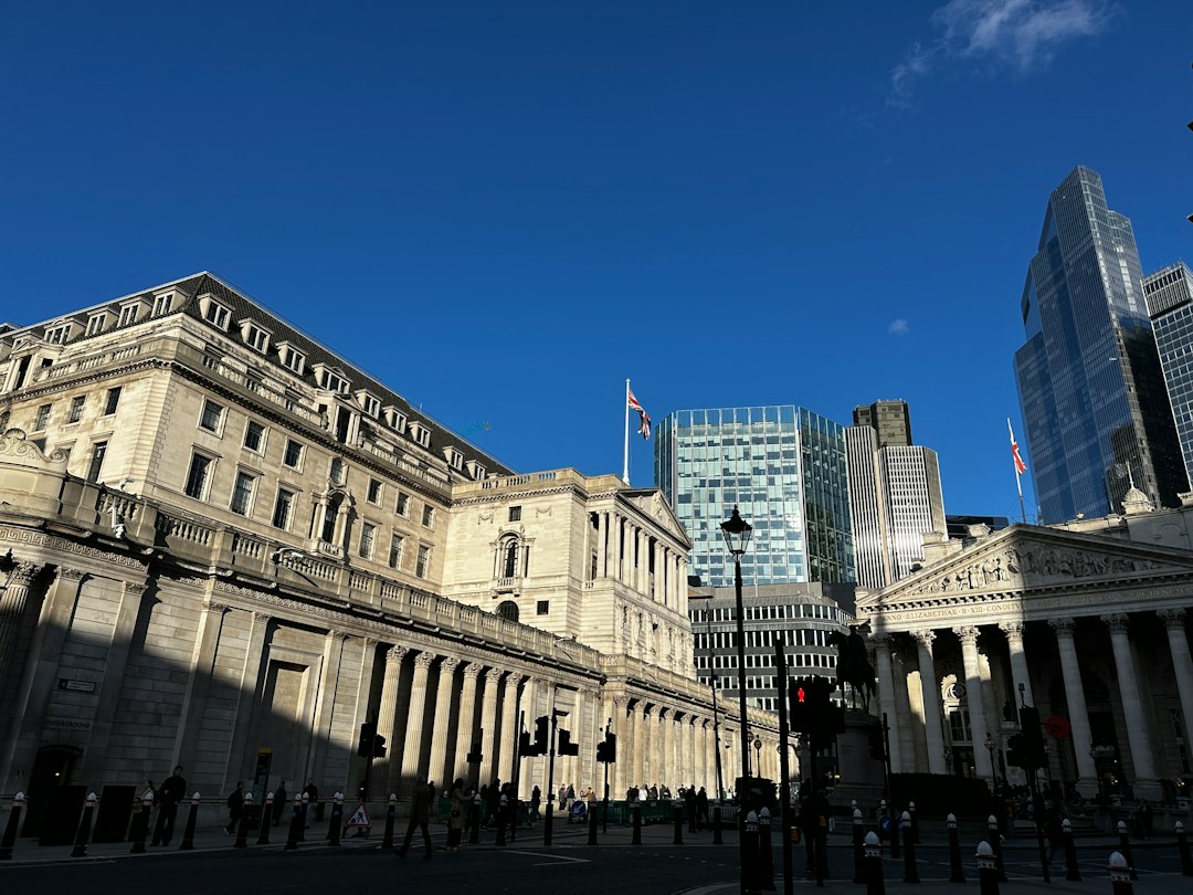 Modern and historic buildings under a clear blue sky