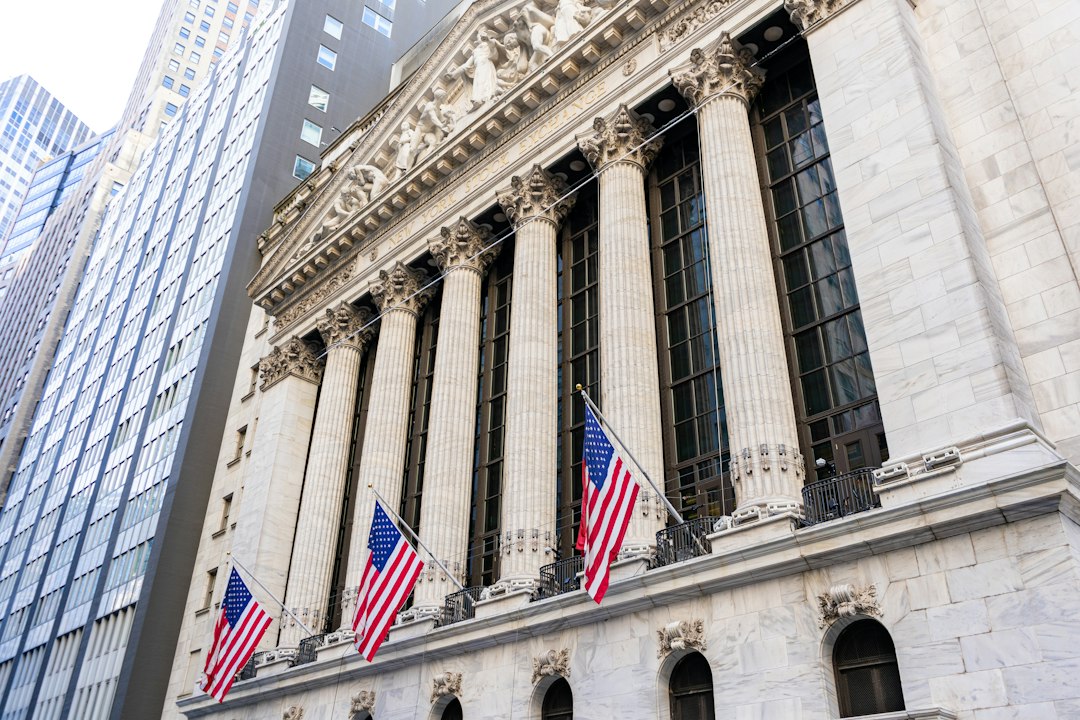 New york stock exchange building with american flags.