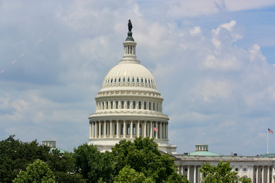 United states capitol building dome against a cloudy sky