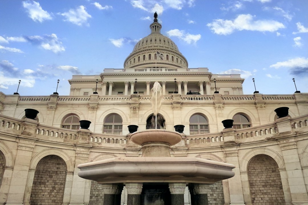 a large building with a fountain in front of it