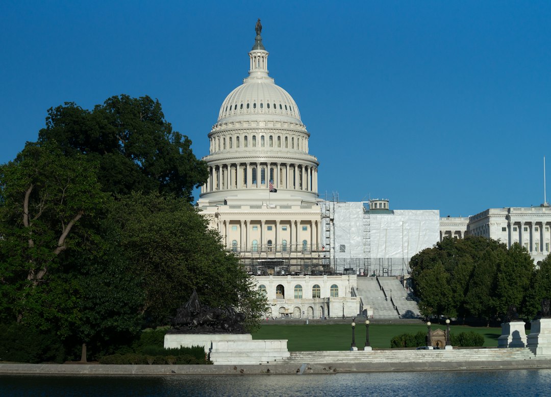 The capitol building in washington d c is reflected in the water